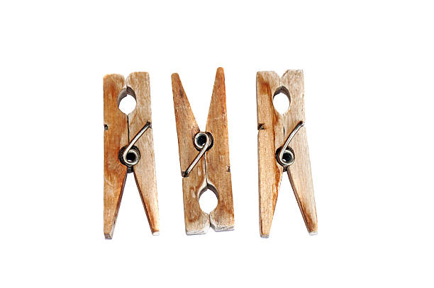 istock Three wooden clothespins isolated 504512161
