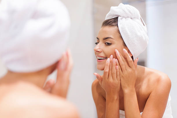 istock Woman removing pimple from her face 504512329