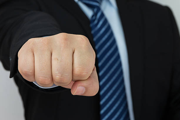 istock Businessman fist protrudes 504522880