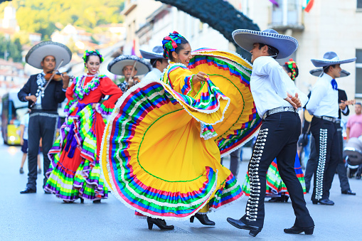 Veliko Tarnovo, Bulgaria - July 25, 2015: Mexican folklore group dancing in Veliko Tarnovo. Mexican woman in traditional costume plays traditional dance on \