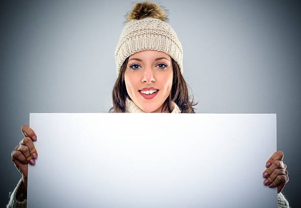 istock Gorgeous young woman holding a blank sign 504523536