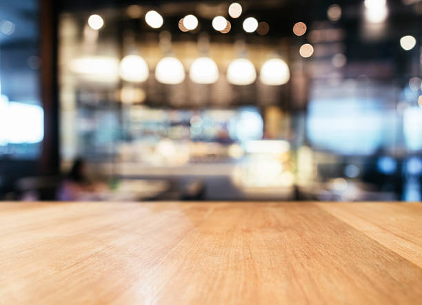 istock Table top with Blurred Bar restaurant cafe interior background 504523550