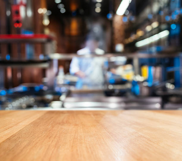 istock Table top counter blurred Kitchen and Chef cooking background 504523706