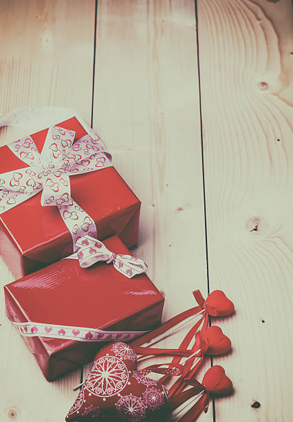 istock Valentine's day background with red hearts  on wooden table. 504524524