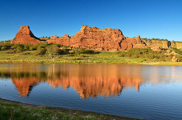 South Valley Reflection Red Sandstone reflected in a pond at South Valley Open Space Park, Jefferson County Colorado littleton colorado stock pictures, royalty-free photos & images