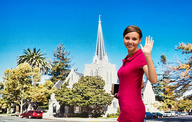 istock Worshipper waving hand outdoors 504525734