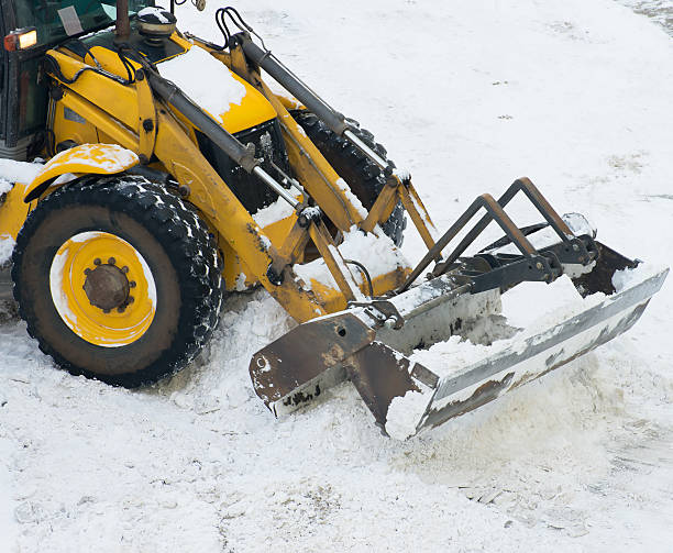 istock Tractor shoveling snow on the street. 504526606