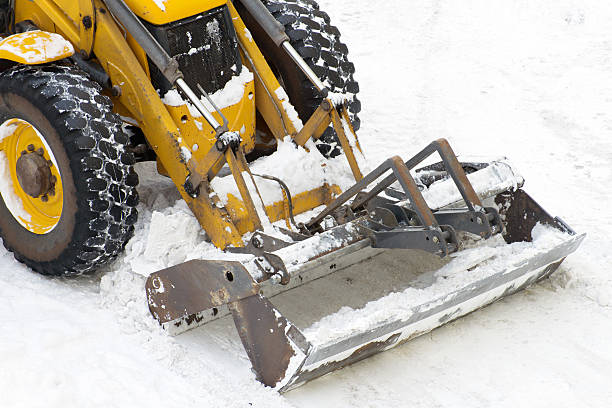 istock Tractor shoveling snow on the street. 504526624