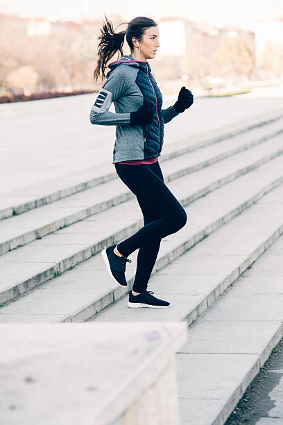 istock Woman Running Down The Stairs 504526806