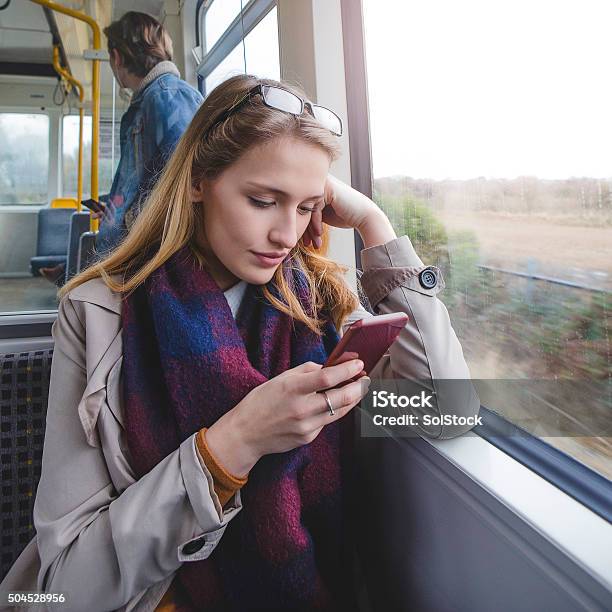 Woman Using Smartphone On Train Stock Photo - Download Image Now - Blurred Motion, Adult, Adults Only