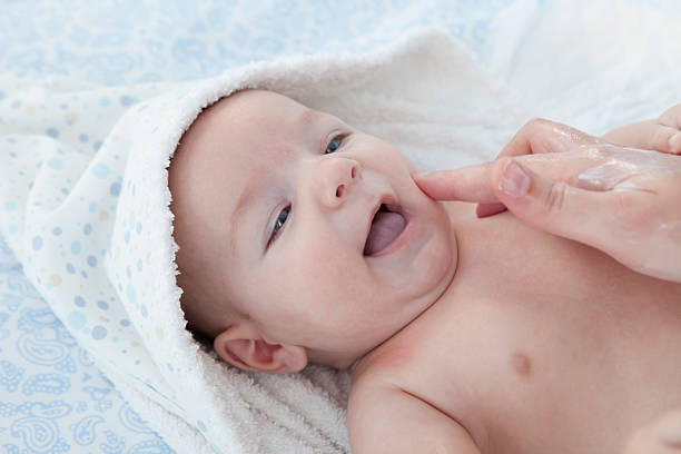 istock Mother applying cream over baby boy 504530982