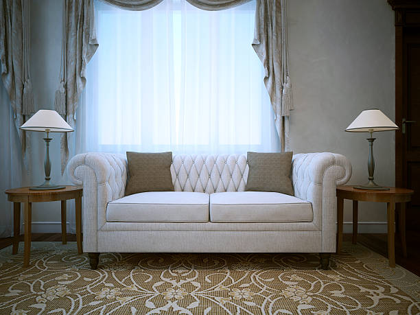 White linen cotton sofa with lamps on tables both sides