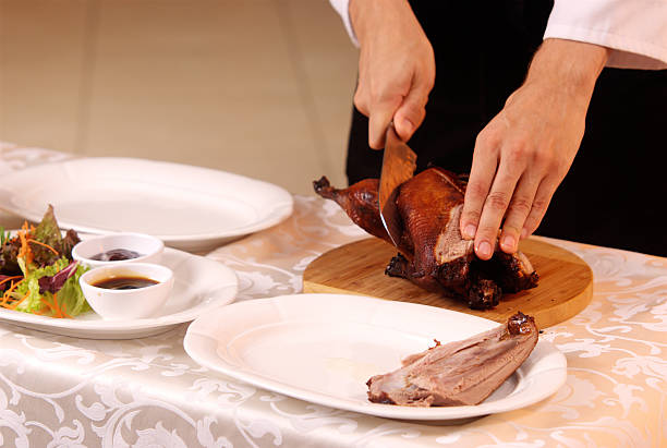istock cooking roast duck in restaurant 504535208