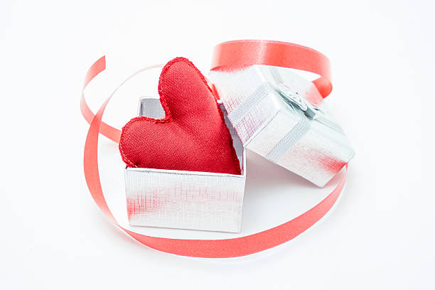 istock gift box with a bow and a red heart inside 504535762