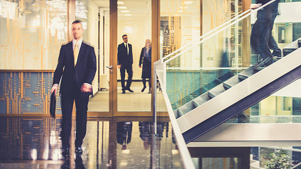 istock Businesspeople walking in office corridor, blurred motion 504535970