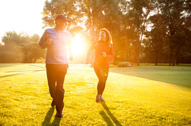 istock Mature couple running outdoors 504536236