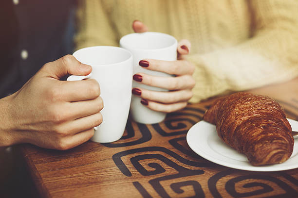 istock Couple in love drinking coffee. Hands close up 504536440