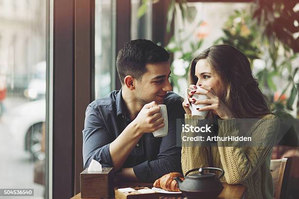 Couple In Love Drinking Coffee In Coffee Shop Stock Photo - Download Image Now - Dating, Couple - Relationship, Coffee - Drink