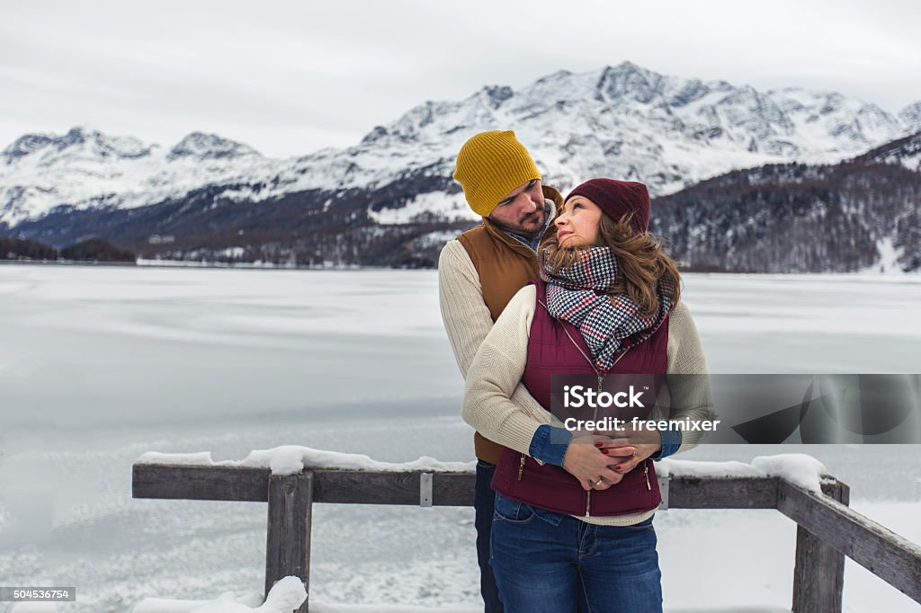 Hugging each other in winter Young couple enjoying a trip to the mountain getaway for the weekend, having fun 20-29 Years Stock Photo