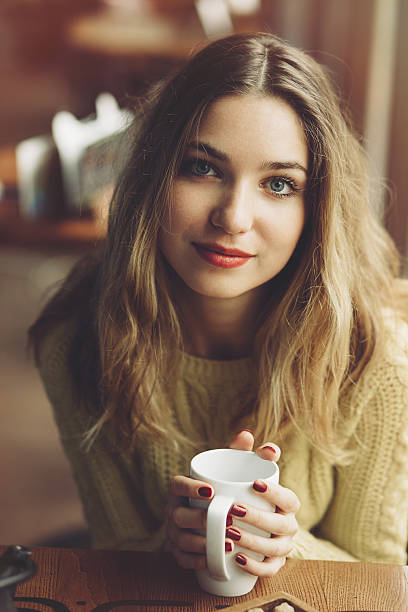 istock Charming girl drinking cappuccino and eating cheesecake 504536864