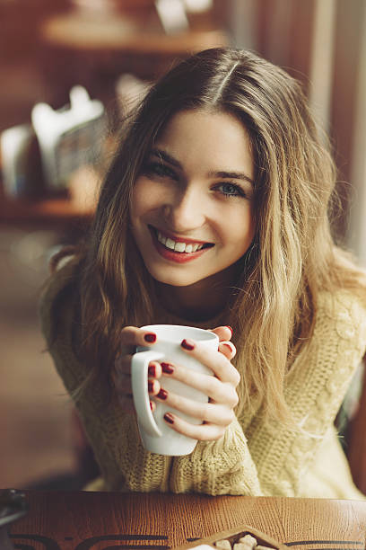 istock Charming girl drinking cappuccino and eating cheesecake 504536902