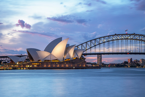 Sydney, NSW, Australia - November 2, 2015: Sydney Opera House and Sydney Harbour Bridge illuminated at dusk 