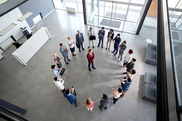 istock Working team with manager in centre of circle 504539418