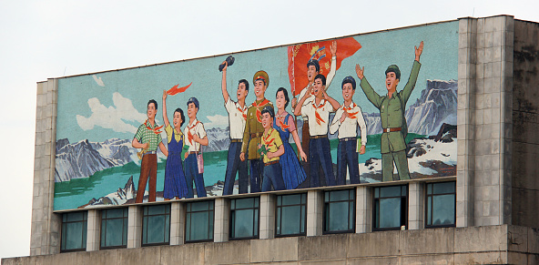 Pyongyang, North Korea - August 16, 2013: A socialist realist mural on the front of the Mangyongdae Schoolchildren's Palace depicting the proud students who attend the academy.