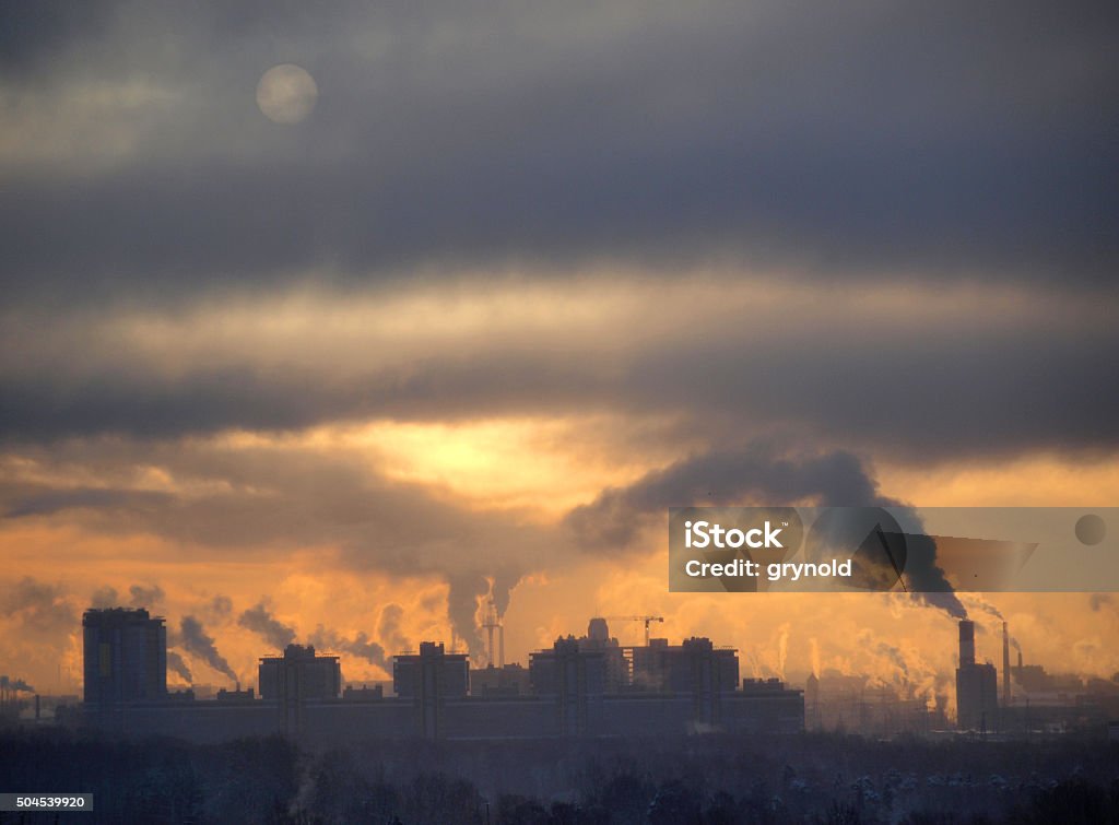 Smoke on city Industrial buildings at sunset sky Pollution Stock Photo