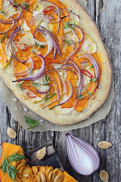 Pizza with pumpkin,apple and red onion