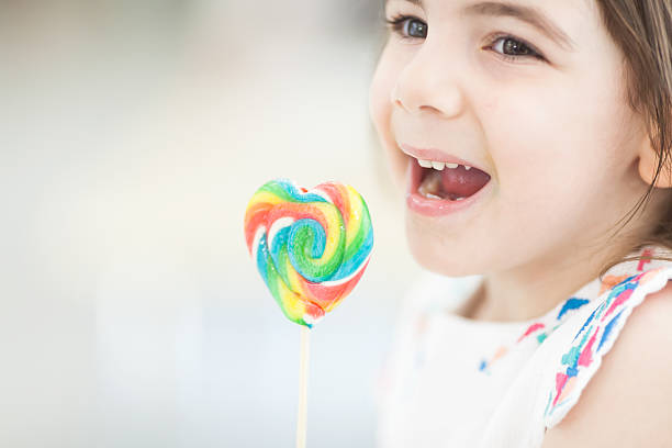 istock Little girl with candy 504541087