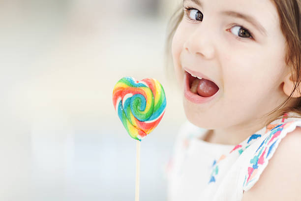 istock Little girl with lollipop 504541097
