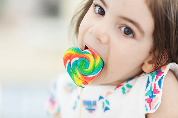 istock Little girl with candy 504541101