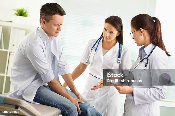 Knee Pain Stock Photo - Download Image Now - Adult, Assistant, Doctor