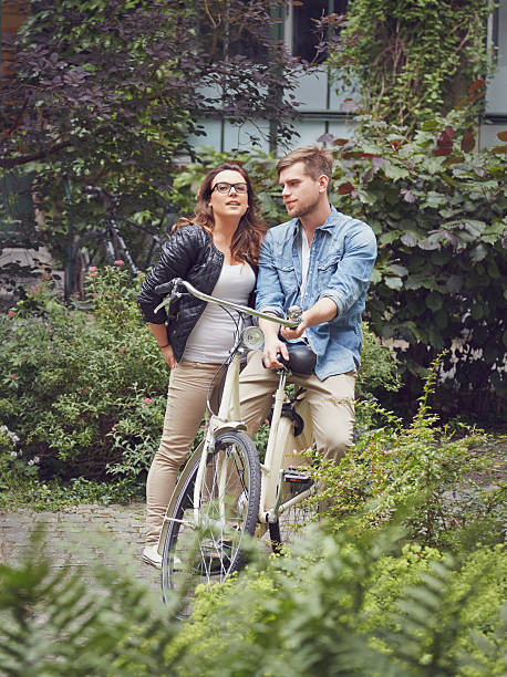 istock Young couple with bicycle 504542789