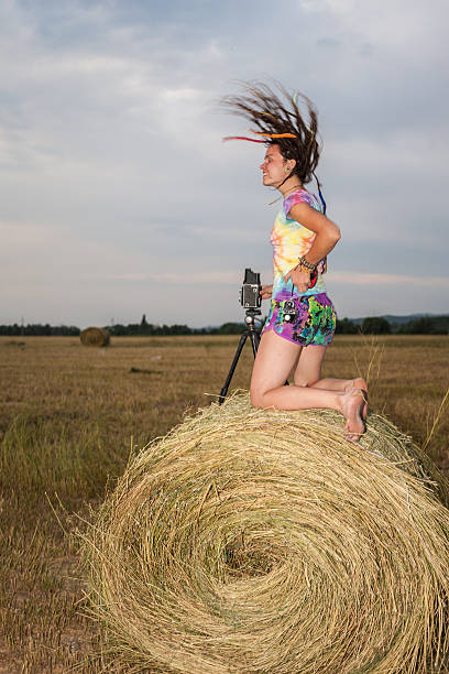 istock Girl jumping on a hay field 504545039