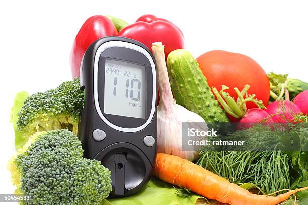 Glucose Meter And Fresh Vegetables On Wooden Cutting Board Stock Photo - Download Image Now