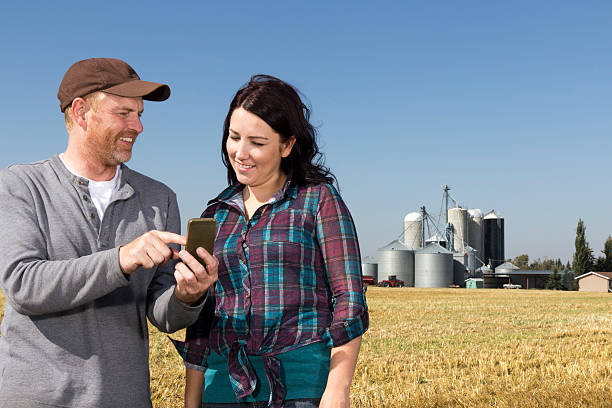 istock Farmer Couple with Smartphone 504561837