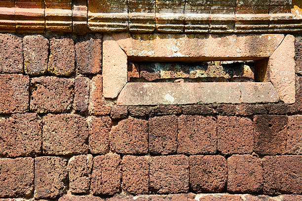 istock window on laterite wall, Panomrung historical park, Thailand 504562987