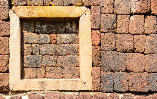 window on laterite wall, Panomrung historical park, Thailand