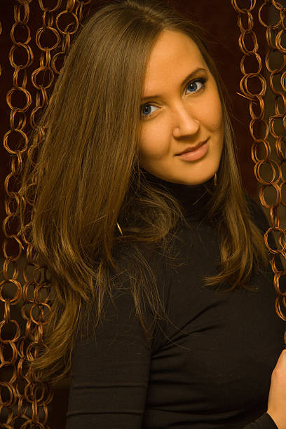 Pretty girl on a dark background stock photo