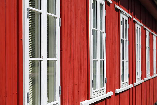 istock Endless windows in a red wooden house 504566055