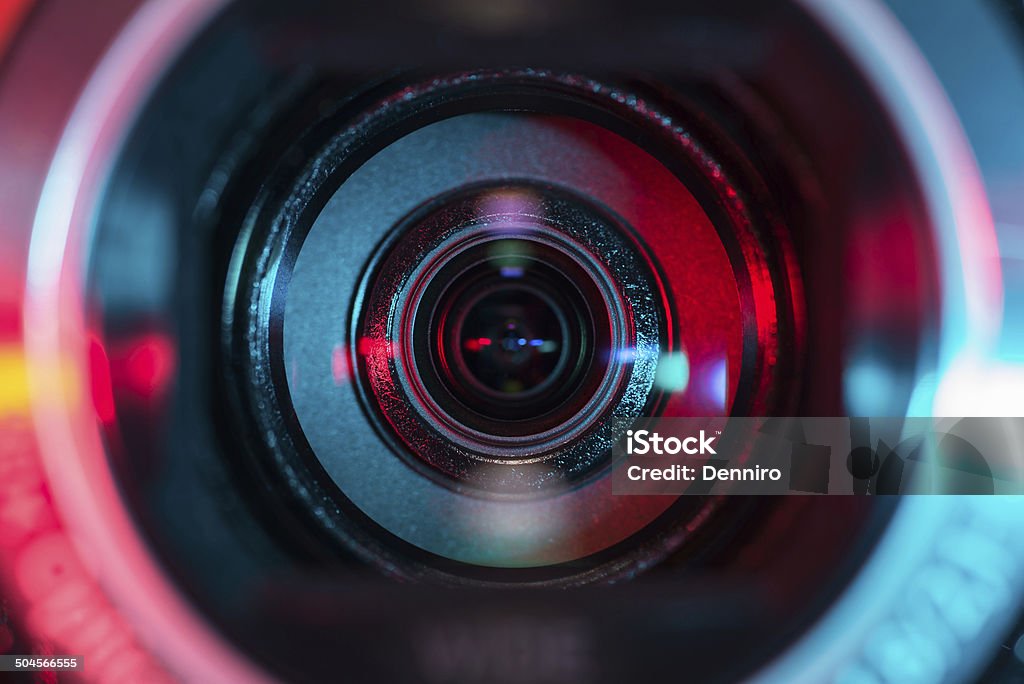 Video camera lens Video camera lens lit in red and blue Home Video Camera Stock Photo