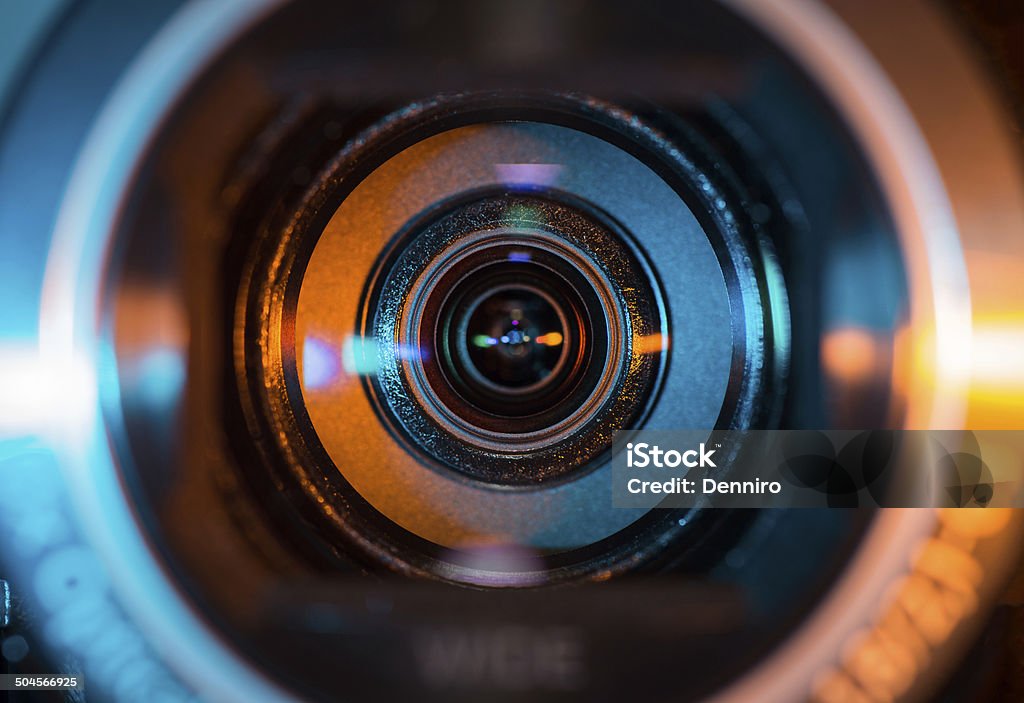 Video camera lens Video camera lens lit in blue and orange Home Video Camera Stock Photo