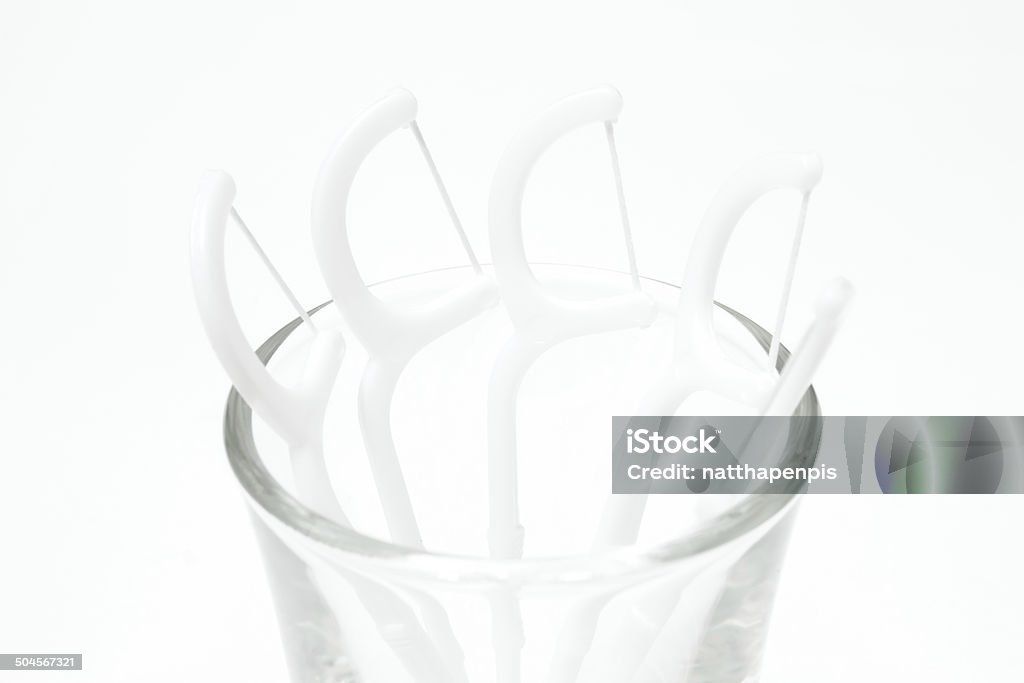 dental floss dental floss in a glass. Brushing Teeth Stock Photo