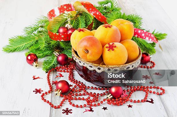 Apricots And Christmas Decorations Stock Photo - Download Image Now - Apricot, Backgrounds, Branch - Plant Part