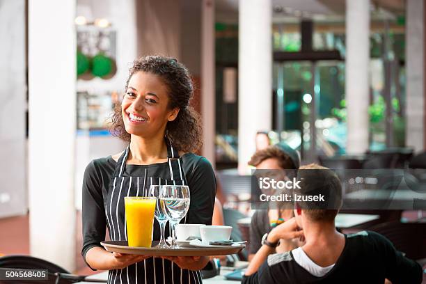 Cheerful Waiter Serving Drinks Stock Photo - Download Image Now - Part-Time Job, Waiter, Occupation