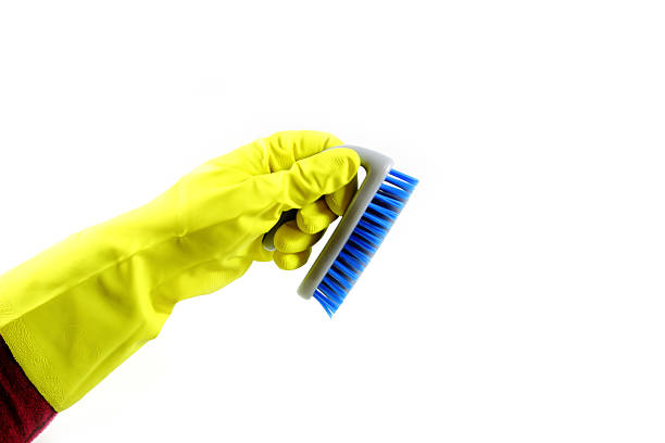 istock Hand with blue cleaning brush 504569039