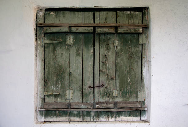istock Old wooden shutters on the wall 504569523