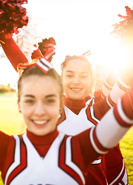 istock Happiness cheerleaders posing with pon-pon 504569555